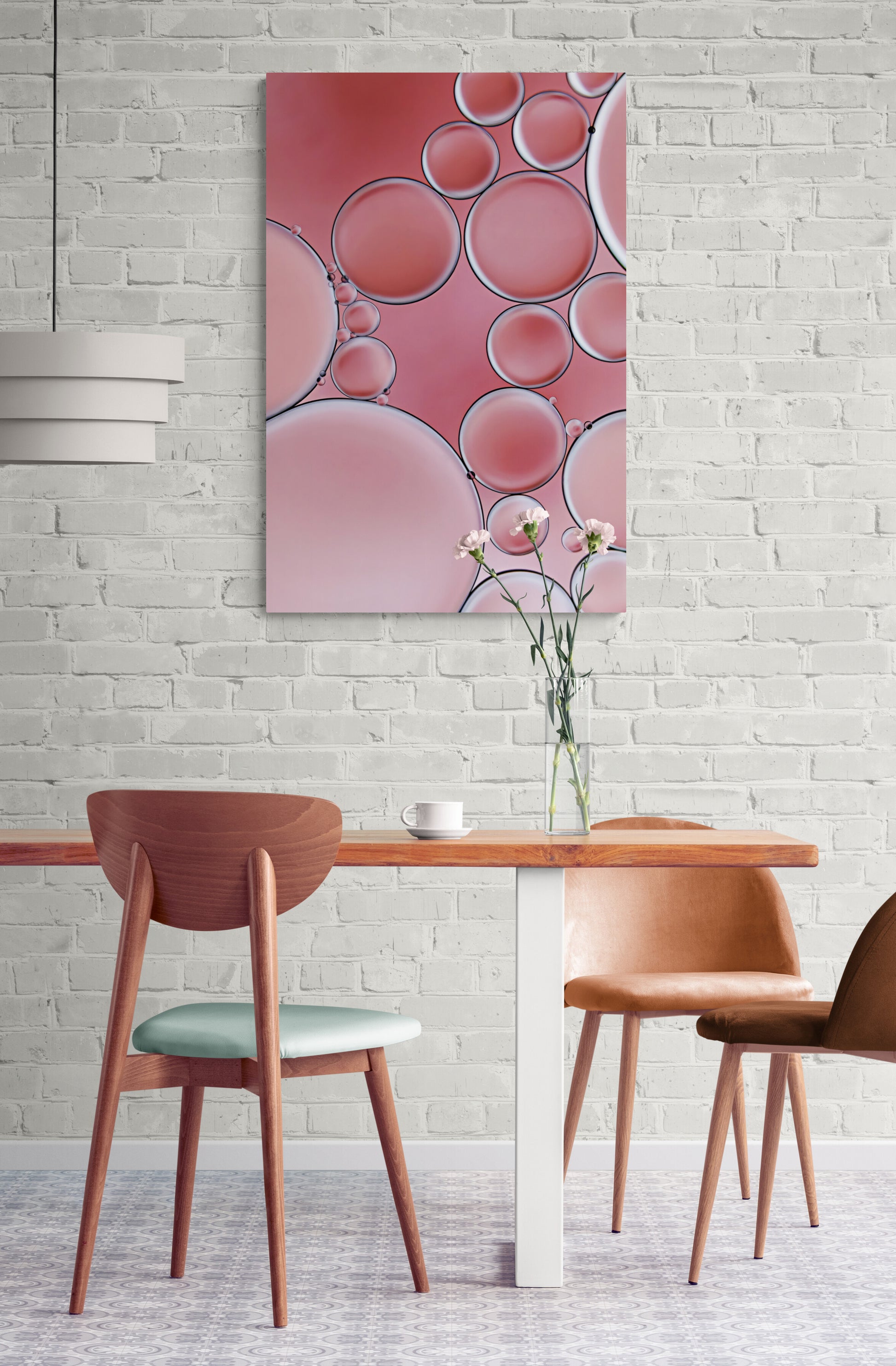 "Cozy Coral 3" is a contemporary acrylic wall art piece. It features an abstract, modern design with captivating coral colors and intricate textures created using oil and water. A visually engaging addition to any space. "Cozy Coral 3" is shown hanging in a dining room.