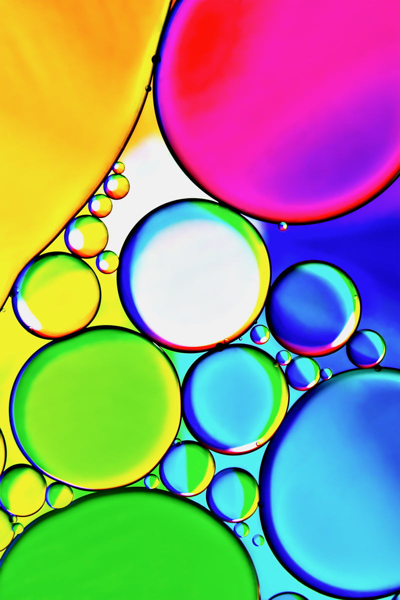 "Rainbow 2" is a captivating fine art photography piece blending oil and water into a stunning visual display. It complements "Rainbow 1" and captures colorful fluidity, suitable for various interiors. Available as a gallery-quality acrylic photo print, it features metallic paper, 1/4" acrylic, dibond backing, polished edges, and floating hardware. Abstract and vibrant, "Rainbow 2" celebrates color fusion.
