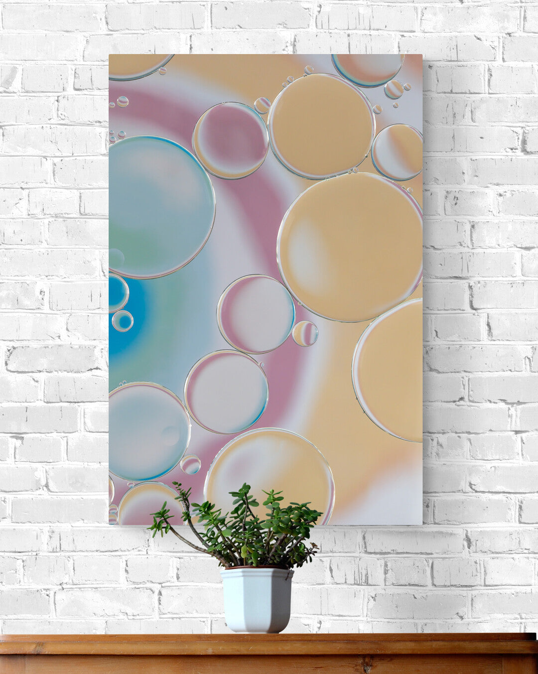 An abstract photography print titled "Rainbow Rhapsody 1" showcasing a dynamic blend of orange, pink, white, green, and blue hues. The vibrant colors dance in a harmonious pattern, creating a visually stunning piece of wall art.