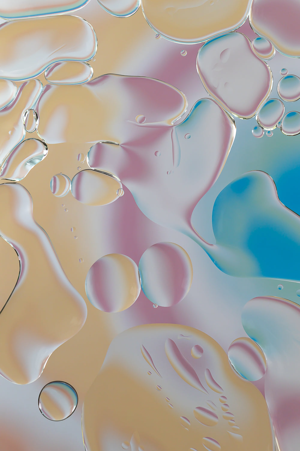 "Rainbow Splatter" is an abstract acrylic photo print featuring a macro photograph of oil and water. The image displays a vivid mix of colors including orange, pink, white, green, and blue, creating a pattern that resembles a splatter painting. This contemporary art piece, part of the Rainbow Rhapsody collection, can be displayed alone or with other similar artworks. It evokes a sense of dynamic movement and vibrant energy.