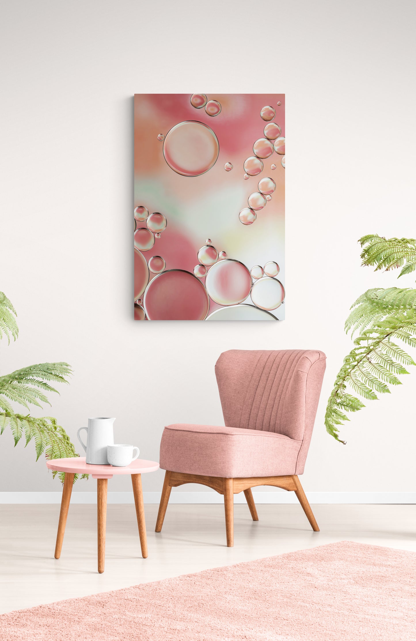 Explore "Blossoms 4," a vibrant contemporary abstract photograph in which circular shapes and shades of pink, yellow and green create a beautiful and unique composition. Perfect for your wall. Can be paired with any of the other images in the "Blossoms" collection to create a diptych or triptych. High-quality acrylic print. Detailed gallery print on metallic paper, face-mounted on acrylic for a captivating effect. "Blossoms 4" is shown in a living room on a white wall with pink chair and coffee table.